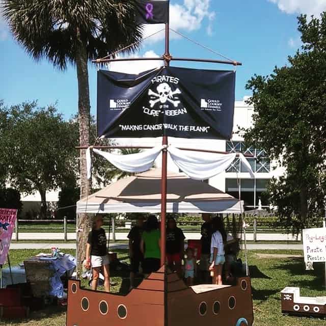 Gould Cooksey Fennell sponsor flag at the Pirates for a Cure event