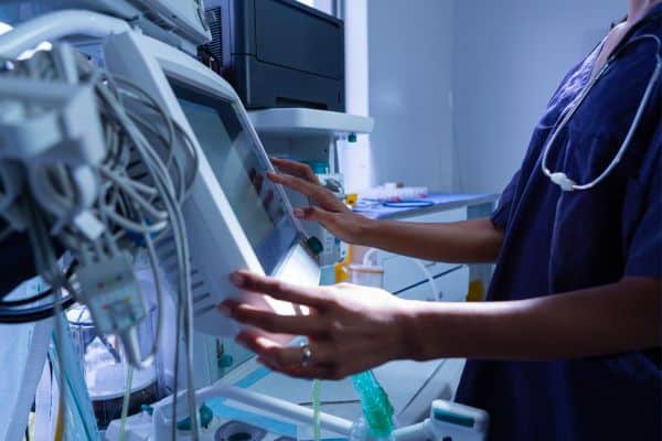 nurse entering medical data into a computer