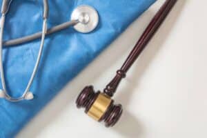 Gavel with doctors equipment